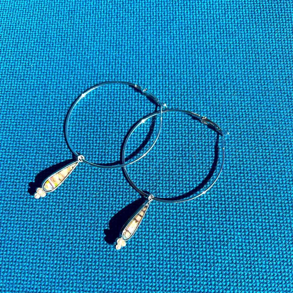 Beautiful hoop earrings asking $10.00 a piece..